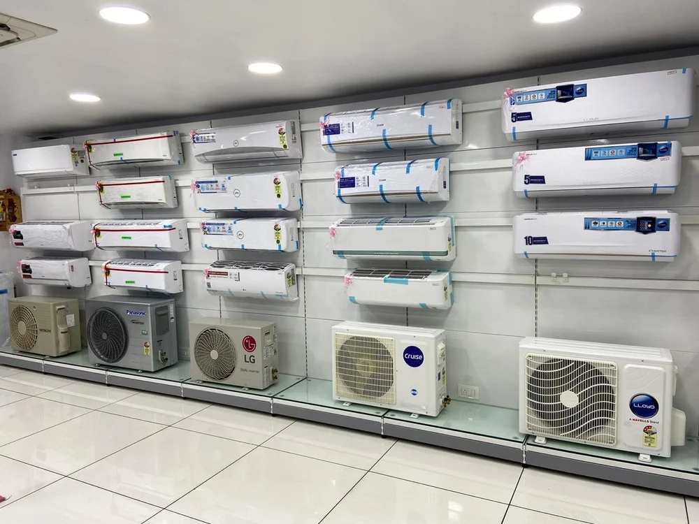 AC showroom display rack with various air conditioner models in Pune